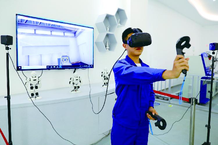 学生通过vr技术体验工业机器人组装生产